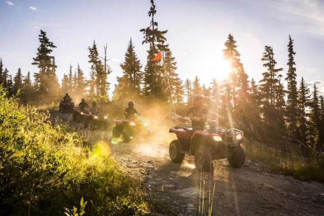 ATV riding through backcountry trails in summer